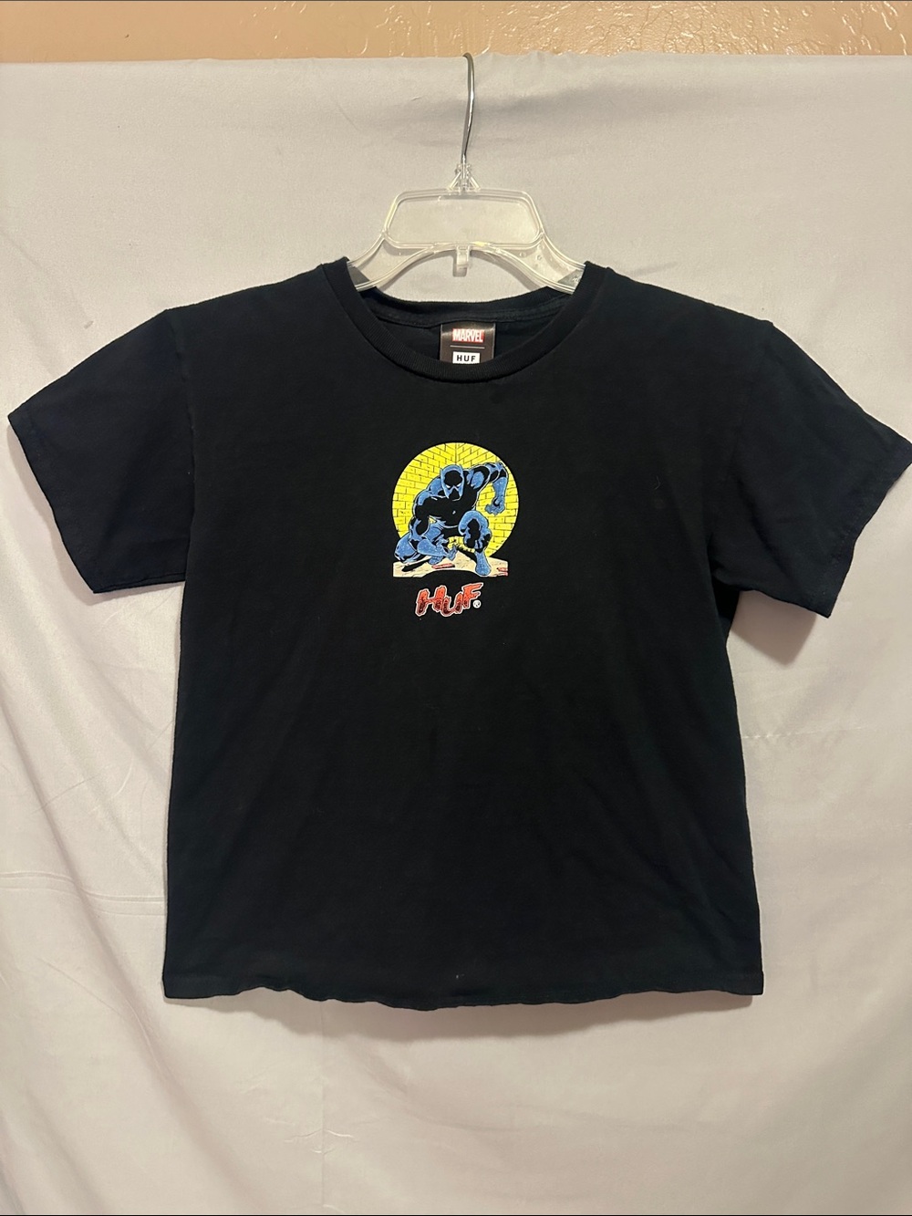 HUF Kids Black Tee with Blue & Yellow Superhero Graphic